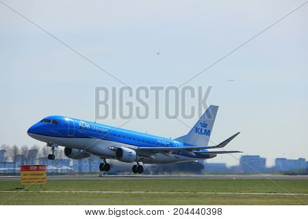 Amsterdam the Netherlands - March 25th 2017: PH-EXK KLM Cityhopper Embraer ERJ-175 takeoff from Polderbaan runway.
