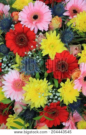 Mixed flower arrangement: various flowers in different colors for a wedding