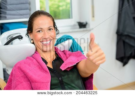 Woman With Thumb Up In  Barber Shop