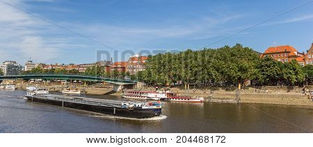 BREMEN, GERMANY - AUGUST 23, 2017: Panorama of a freifgt boat on the river Weser in Bremen Germany