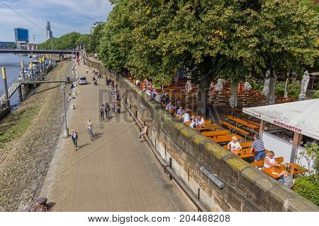 BREMEN, GERMANY - AUGUST 23, 2017: Outside cafe along the river Weser in Bremen Germany