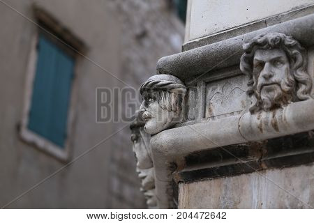 Sibenik cathedral / Famous faces on the side protal of Sibenik cathedral