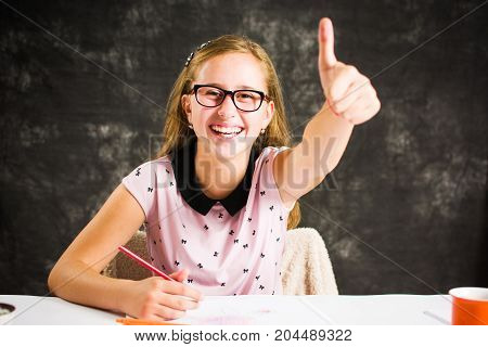 Teenage Girl Drawing With Colorful Pencils
