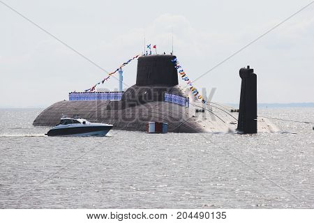 A line of modern russian military submarine cruisers in the row, northern fleet and baltic sea fleet in the open sea, submarine