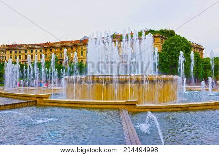 The fountain on place at Sforza Castle in summer day. Milan, Italy