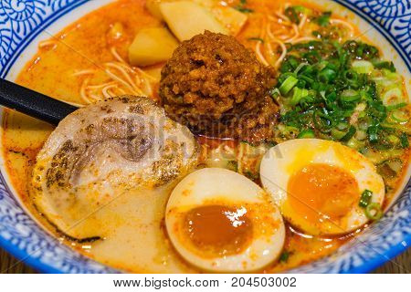 Japanese Tamago Spicy Ramen With Cha Shu Pork On Wooden Background