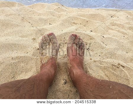 Sandy feet on vacation at a beach on Maui Hawaii