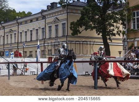 TURKU, FINLAND ON JUNE 30. View of knights during a performance, show on June 30, 2017 in Turku, Finland. Historical, medieval outdoor play. Unidentified fighter, war-horse. Editorial use.