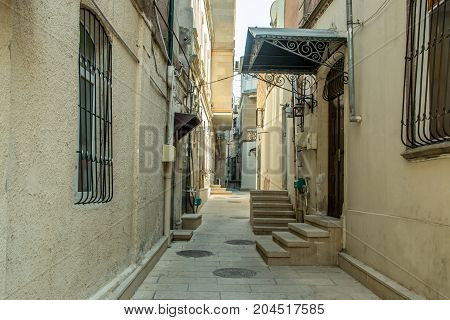 Narrow old classic empty street in Old City of Baku - Icheri Sheher. Historical core of Baku