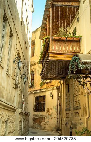 Narrow old classic empty street in Old City of Baku - Icheri Sheher. Historical core of Baku