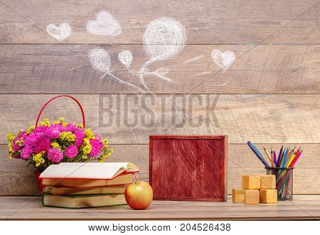 Back to school concepty with clear blackboard background, desk, items