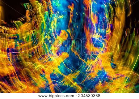 Abstract with multiple color swirling lights in motion.