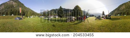 HEILIGENBLUT, AUSTRIA - 27.08.2017: Panoramic View of Trailers camping under the Grossglockner mountain in Hohe Tauern national park in Austria