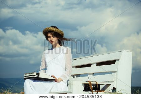 Girl In Wreath And White Dress On Bench