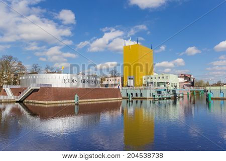 GRONINGEN, NETHERLANDS - APRIL 03, 2017: Museum of Groningen with reflection in the water in The Netherlands