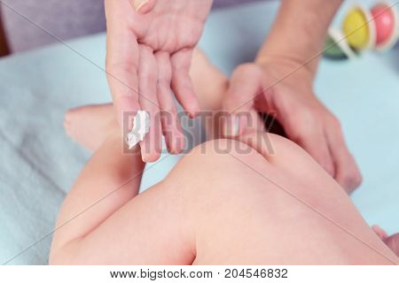 Mom Applying Some Cream By Her Hand To The Babby Ass