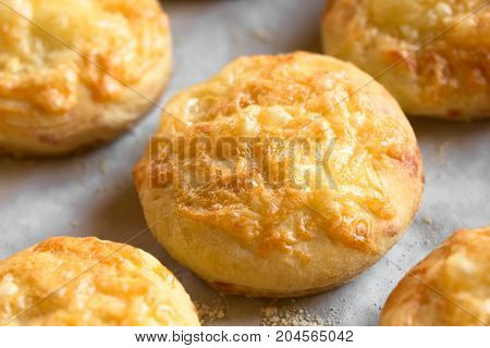 Hungarian traditional Cheese Pogacsa savory baked bread-like pastry photographed with natural light (Selective Focus Focus in the middle of the image)