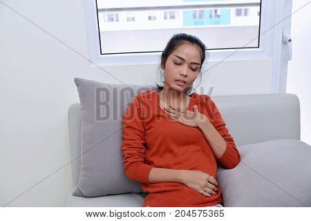 Young Asian Woman Feeling Pain In Her Chest