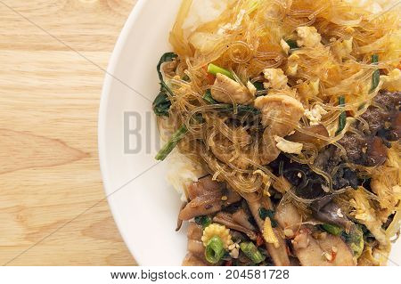 Sweet vermicelli fried with vegetable and chicken on rice