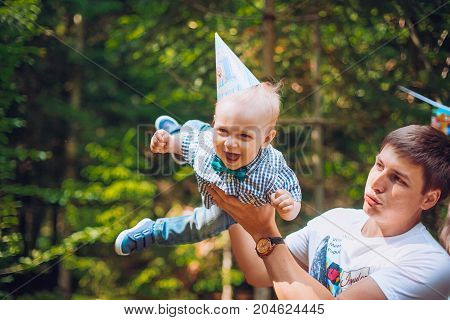 Cute father and son playing together at the park