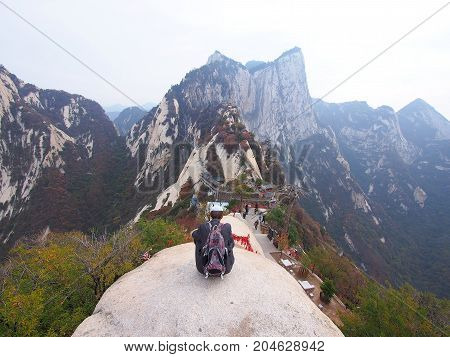 Old Guy And A Stunning View From The Peak Of Huashan Mountain. Xian, China - October 18Th, 2013