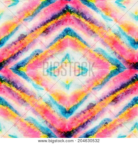 Seamless tie-dye pattern of bright color on white silk. Hand painting fabrics - nodular batik. Shibori dyeing.