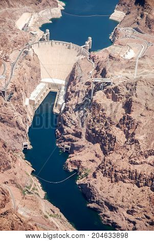 Hoover Dam is a concrete arch-gravity dam in the Black Canyon of the Colorado River, on the border between the U.S. states of Arizona and Nevada.