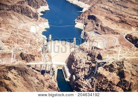 Hoover Dam is a concrete arch-gravity dam in the Black Canyon of the Colorado River, on the border between the U.S. states of Arizona and Nevada.