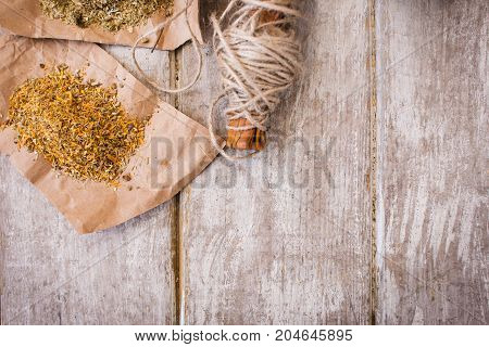 Homemade pharmacy background with free space. Medical infusion preparation top view, homeopathy therapy closeup, quackery concept