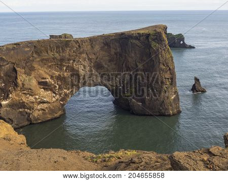 Rock arch at Dyrholaey coast, South Iceland.