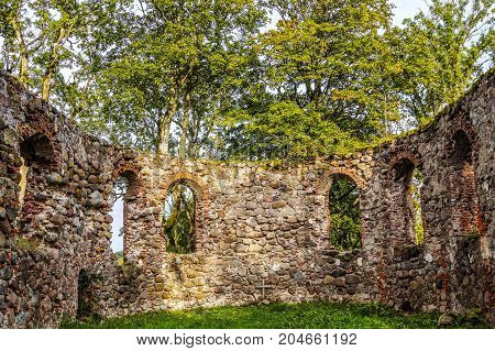 very old Kazdangas church wall of stones.