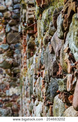very old Kazdangas church wall of stones.