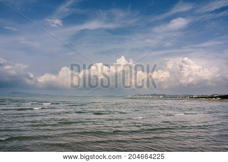 Albania. Golem. Seascape of the Adriatic Sea with cumulus clouds.