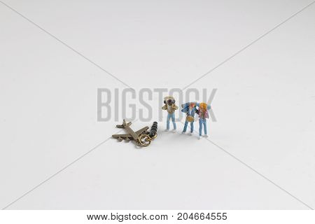 Min Hikers With Backpacks On The White Baord