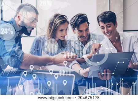 Concept of digital diagram, graph interfaces, virtual screen, connections icon on blurred background.Group of colleagues working with startup project in modern office..Horizontal