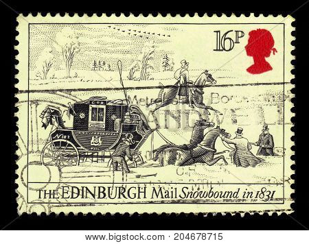 UNITED KINGDOM - CIRCA 1984: A stamp printed in UK shows portrait of Elizabeth II and mail coach stuck in the snow, inscriptions the Edinburgh Mail snowbound in 1831, series postal service Bath-London, circa 1984