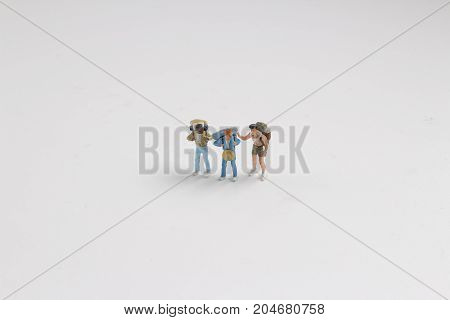 Min Hikers With Backpacks On The White Baord