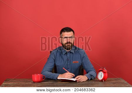 Cup, Retro Clock And Red Book On Vintage Table