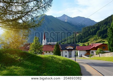Colorful sunny morning in the small town of Berwang. Beautiful outdoor scene in the Austrian Alps.