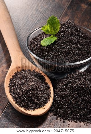 Composition With Bowl Of Poppy Seeds On Wooden Table