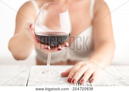 Female With Red Maniсure Nail Hold Glass With Alcohol