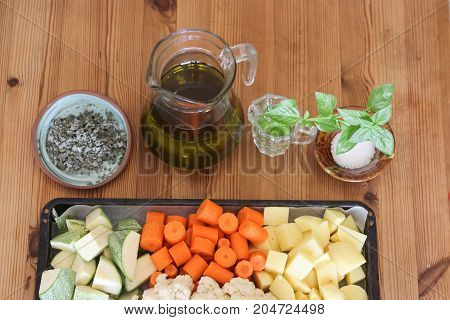Sliced vegetables and some spices ready for baking