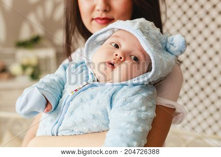 Portrait of a little adorable newborn infant asian baby.