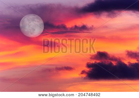 Moon clouds is a colorful surreal fantasy like pink and blue cloudscape with a magical surreal full moon rising in the night sky.