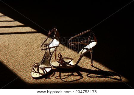 High Heels Shoes in window light. low-key style