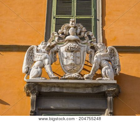 Beautiful sculture on a house front in the historic district of Pisa - Tuscany Italy