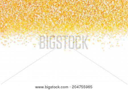 Corn grits groats as decorative border isolated on white background. Top view closeup.