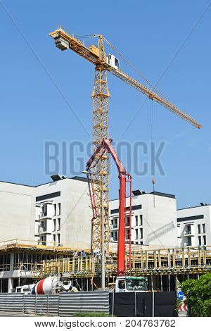 Tower crane at the construction site in the city