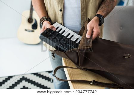 Musician Putting Mpc Pad Into Bag