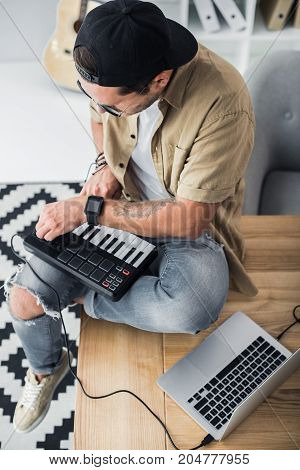 Modern Dj Working With Mpc Pad